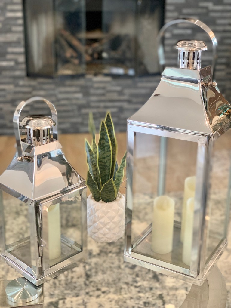 Two lanterns with a plant make a nice trio focal point